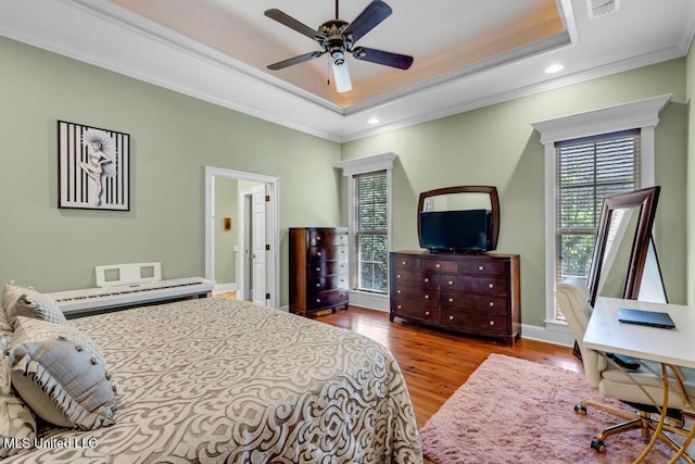 769 Mclane Ln, Biloxi, MS 39532 - bedroom featuring crown molding, a raised ceiling, wood finished floors, recessed lighting, and ceiling fan