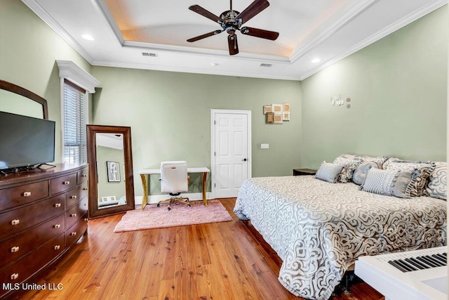 769 Mclane Ln, Biloxi, MS 39532 - bedroom featuring a tray ceiling, wood finished floors, crown molding, and recessed lighting