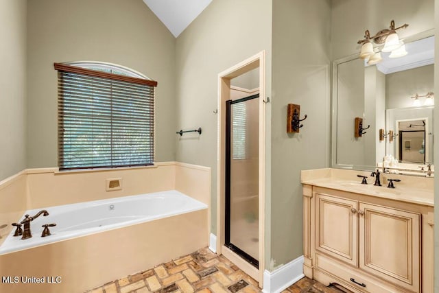 769 Mclane Ln, Biloxi, MS 39532 - bathroom with a bath, a stall shower, vanity, brick floors, and lofted ceiling