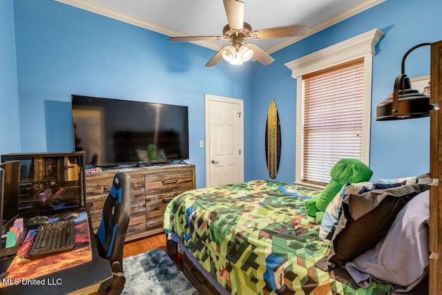 769 Mclane Ln, Biloxi, MS 39532 - bedroom with ornamental molding, wood finished floors, and a ceiling fan