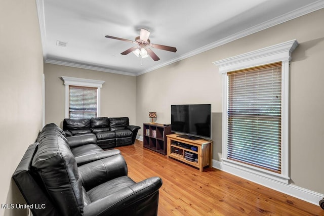 769 Mclane Ln, Biloxi, MS 39532 - living room featuring ceiling fan, crown molding, and light wood finished floors