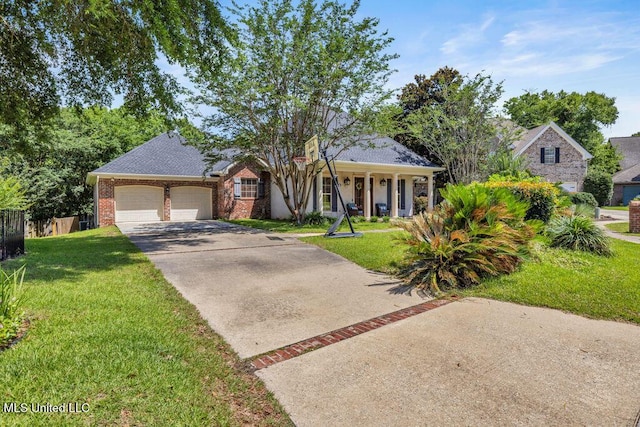 769 Mclane Ln, Biloxi, MS 39532 - view of front of house with an attached garage, driveway, brick siding, and a porch