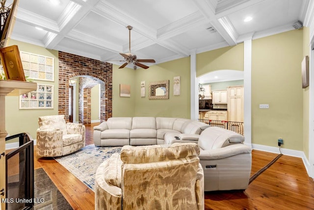 769 Mclane Ln, Biloxi, MS 39532 - living area featuring arched walkways, hardwood / wood-style floors, coffered ceiling, ceiling fan, and beamed ceiling