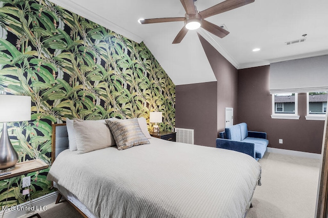 carpeted bedroom with crown molding, vaulted ceiling, and ceiling fan