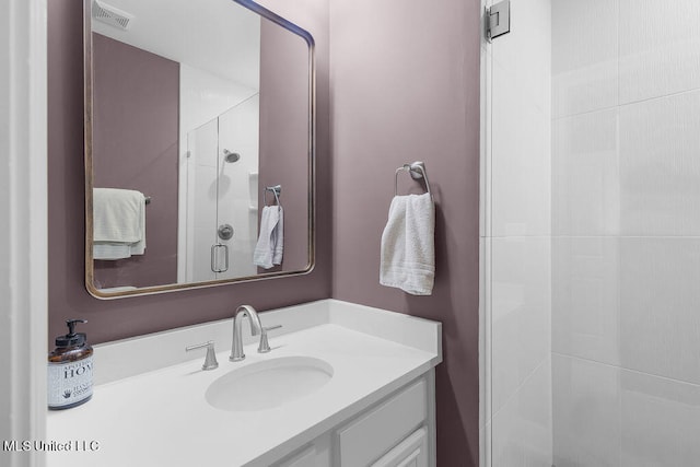 bathroom with vanity and an enclosed shower