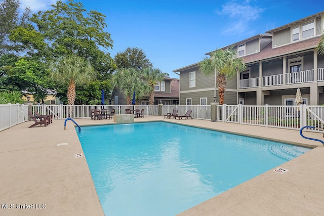 view of swimming pool with a patio area