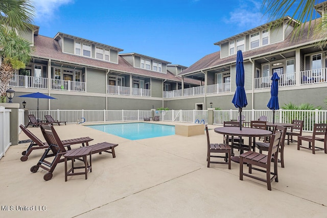 view of swimming pool with a patio area