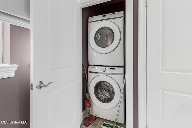 laundry area featuring stacked washer and clothes dryer