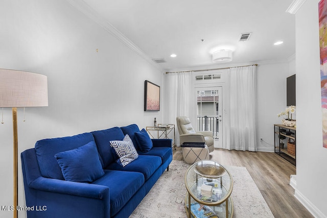 living room featuring ornamental molding and hardwood / wood-style flooring