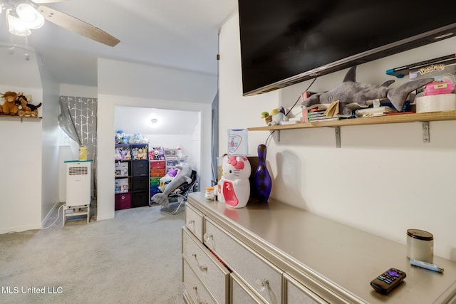 interior space featuring ceiling fan and light carpet