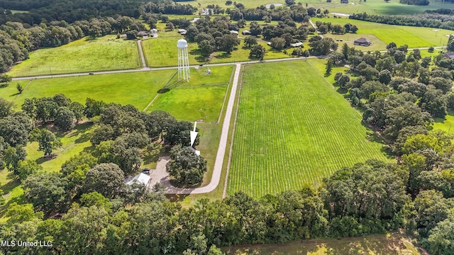 birds eye view of property with a rural view