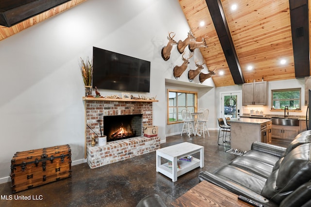 living room with finished concrete flooring, high vaulted ceiling, wood ceiling, and baseboards