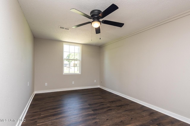 6236 Tulane Rd, Horn Lake, MS 38637 - spare room featuring ceiling fan, dark wood-style floors, a textured ceiling, and baseboards