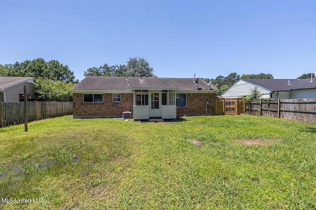6236 Tulane Rd, Horn Lake, MS 38637 - rear view of property with brick siding, central AC, and a sunroom