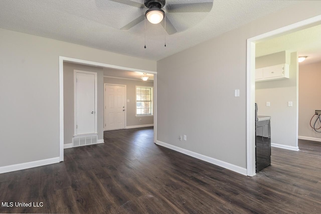 6236 Tulane Rd, Horn Lake, MS 38637 - spare room with dark wood-style flooring, a ceiling fan, baseboards, and a textured ceiling