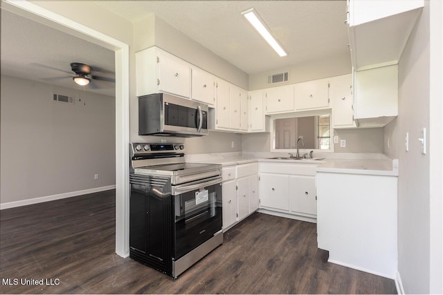 6236 Tulane Rd, Horn Lake, MS 38637 - kitchen with stainless steel appliances, a sink, a ceiling fan, and dark wood finished floors