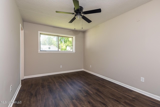 6236 Tulane Rd, Horn Lake, MS 38637 - empty room with dark wood finished floors, a textured ceiling, baseboards, and ceiling fan