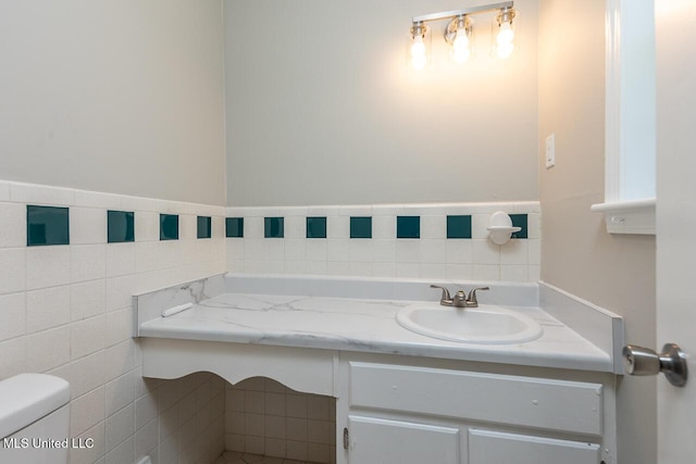 6236 Tulane Rd, Horn Lake, MS 38637 - half bath featuring tile walls, vanity, and toilet