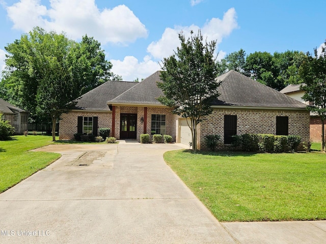 119 Hemlock Ln, Madison, MS 39110 - view of front facade featuring driveway, brick siding, a garage, and a front lawn