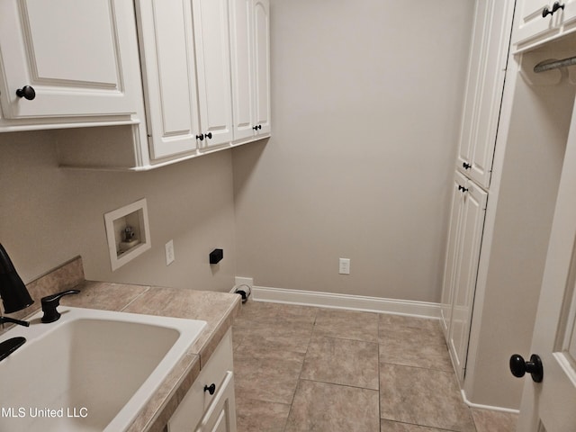 119 Hemlock Ln, Madison, MS 39110 - laundry area with hookup for a washing machine, cabinet space, and light tile patterned floors