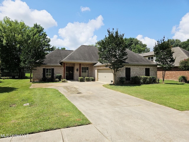 119 Hemlock Ln, Madison, MS 39110 - view of front of house with concrete driveway, a garage, a front yard, and brick siding