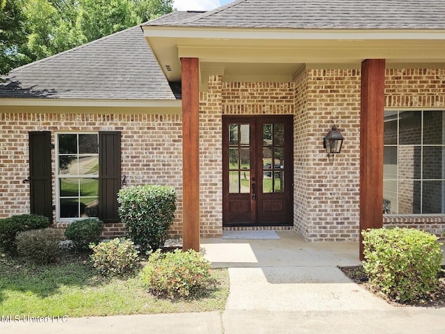 119 Hemlock Ln, Madison, MS 39110 - doorway to property with a shingled roof, brick siding, and french doors