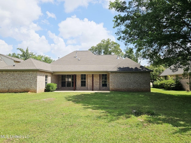 119 Hemlock Ln, Madison, MS 39110 - back of house featuring a lawn and brick siding