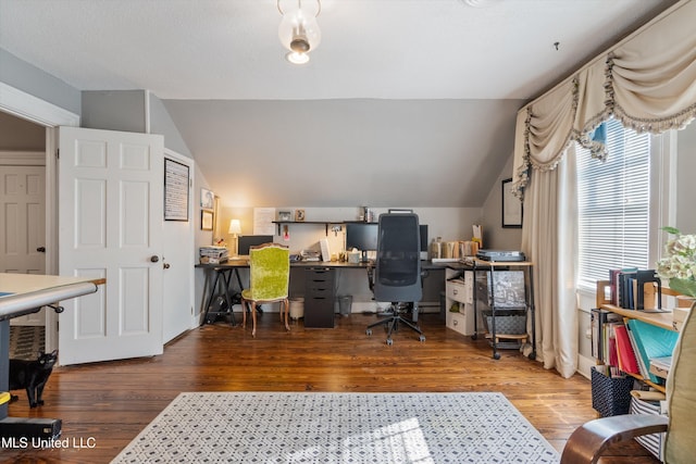 office space featuring hardwood / wood-style flooring and vaulted ceiling