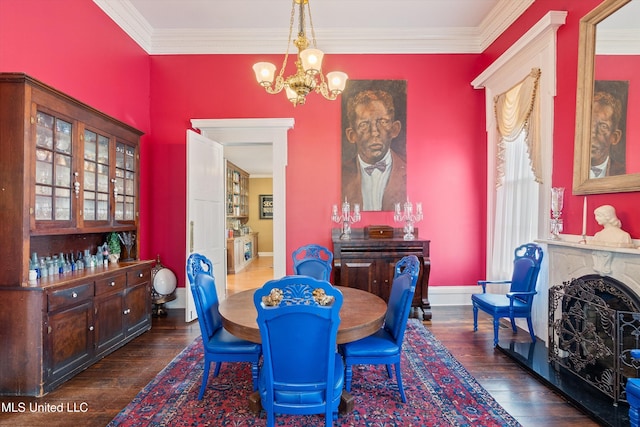 dining area featuring crown molding, a high end fireplace, a notable chandelier, and dark hardwood / wood-style flooring