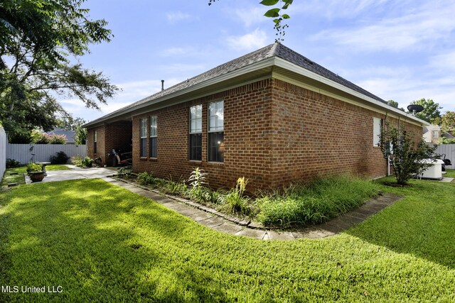 3 Rue Orleans Ct, Long Beach, MS 39560 - view of side of home featuring brick siding and a patio
