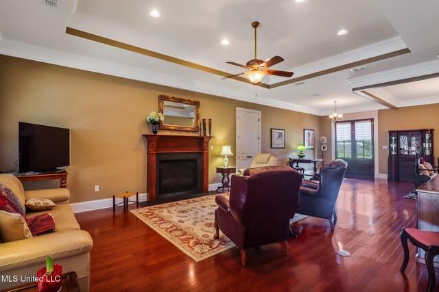 3 Rue Orleans Ct, Long Beach, MS 39560 - living area with a chandelier, a raised ceiling, wood finished floors, a ceiling fan, and ornamental molding