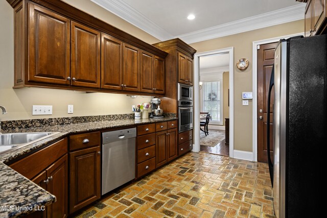 3 Rue Orleans Ct, Long Beach, MS 39560 - kitchen with appliances with stainless steel finishes, a sink, a peninsula, brick flooring, and healthy amount of natural light