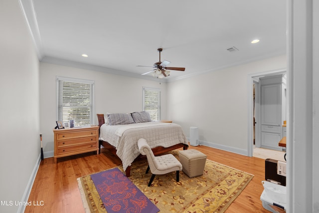 bedroom featuring hardwood / wood-style floors, crown molding, and ceiling fan