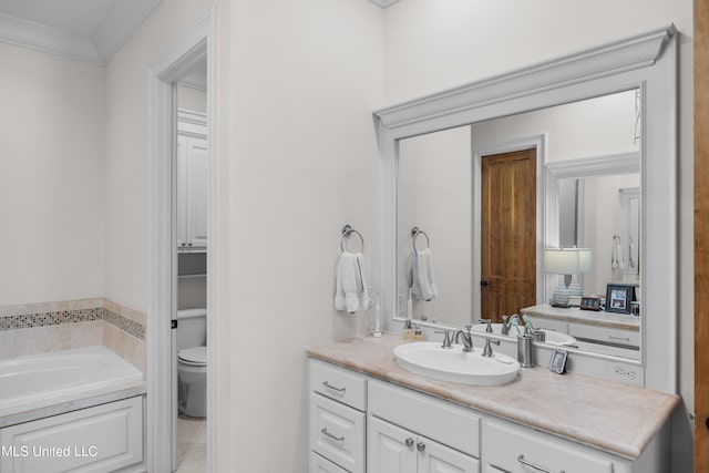 bathroom with vanity, crown molding, toilet, and a washtub