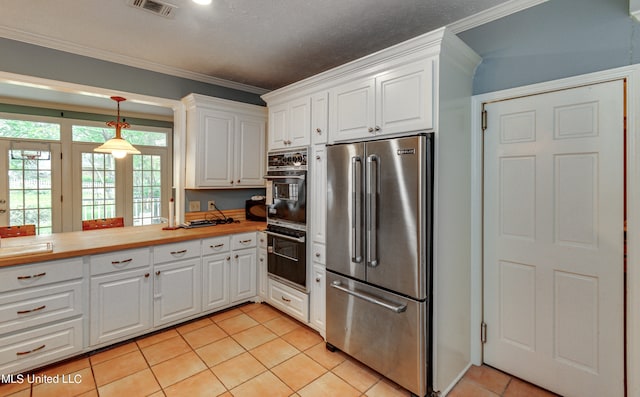 kitchen with white cabinetry, light tile patterned floors, black double oven, and high end fridge