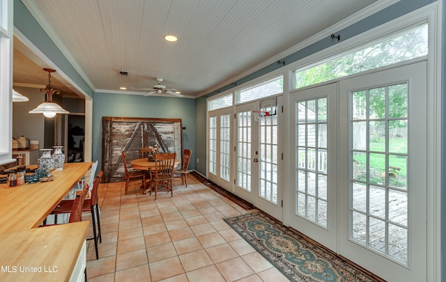 tiled dining room with french doors, ceiling fan, ornamental molding, and wooden ceiling