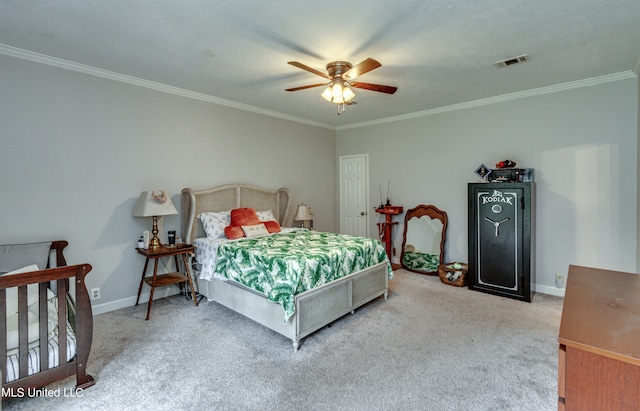 carpeted bedroom featuring ceiling fan and ornamental molding