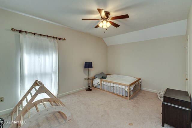 carpeted bedroom with lofted ceiling and ceiling fan