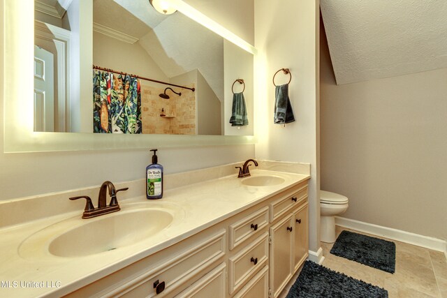 bathroom with curtained shower, a textured ceiling, toilet, vanity, and ornamental molding