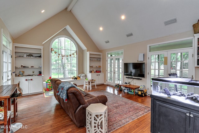 living room with french doors, high vaulted ceiling, hardwood / wood-style flooring, and beamed ceiling