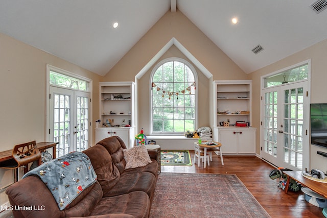 living room with beam ceiling, french doors, dark wood-type flooring, and high vaulted ceiling