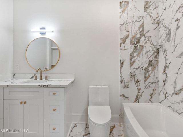 bathroom with a tub to relax in, vanity, and toilet