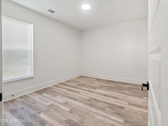 spare room featuring light hardwood / wood-style flooring