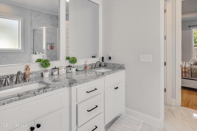 101 Coventry Ln, Canton, MS 39046 - ensuite bathroom featuring a shower stall, marble finish floor, baseboards, and a sink