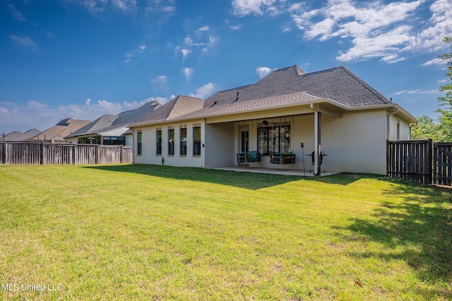 101 Coventry Ln, Canton, MS 39046 - back of property featuring a yard, a fenced backyard, and a patio
