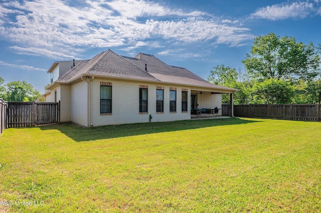 101 Coventry Ln, Canton, MS 39046 - rear view of property with a fenced backyard, a yard, a ceiling fan, and a patio