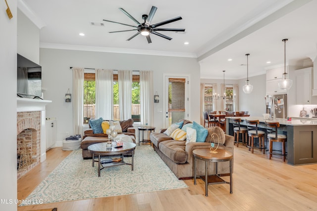 101 Coventry Ln, Canton, MS 39046 - living area with a ceiling fan, crown molding, light wood finished floors, a brick fireplace, and visible vents