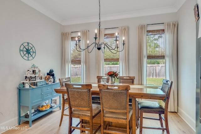 101 Coventry Ln, Canton, MS 39046 - dining area featuring light wood finished floors, baseboards, a chandelier, and ornamental molding