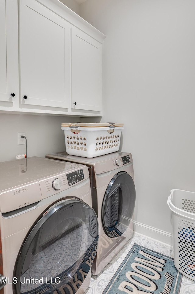 101 Coventry Ln, Canton, MS 39046 - laundry room with baseboards, independent washer and dryer, and cabinet space