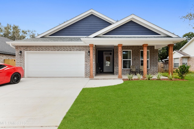 craftsman inspired home with a porch, a front lawn, and a garage